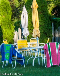 The citrus colors of summer converge in an assemblage of shapes formed from towels, chairs, and umbrellas.