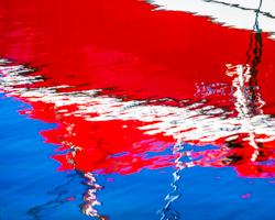 The red, white, and blue sparkle in the reflective summer waters of Green Bay.
