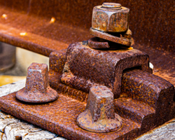 Atop each railroad tie iron rail clamps sit like tiny sculptures with rich rust patina.