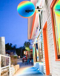 A psychedelic street scene waits patiently for night life to begin.