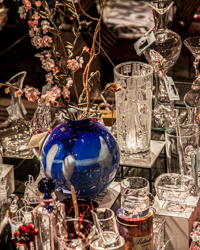 A shop window sparkles with the bouncing light of Venetian cut glass.
